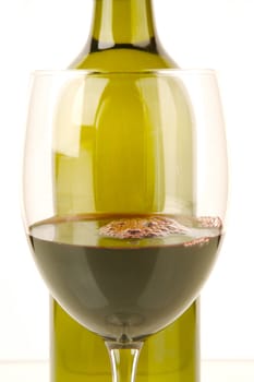 Red and white wine isolated against a white background