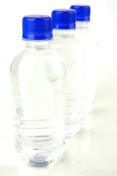 Bottled water isolated against various backgrounds