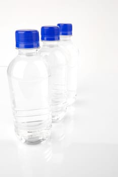 Bottled water isolated against various backgrounds