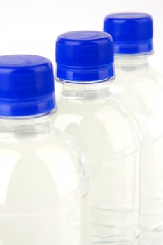 Bottled water isolated against various backgrounds