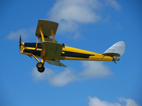 Yellow Vintage Aircraft against the sky