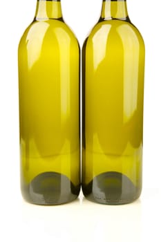White wine bottles isolated against a white background