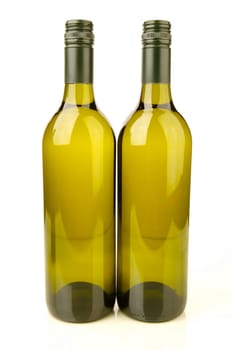 White wine bottles isolated against a white background