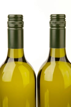 White wine bottles isolated against a white background