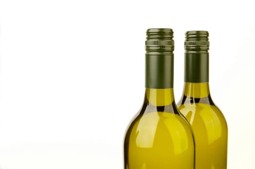 White wine bottles isolated against a white background