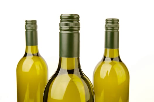 White wine bottles isolated against a white background