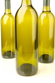 White wine bottles isolated against a white background