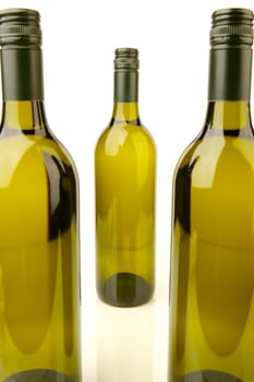 White wine bottles isolated against a white background