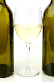 White wine bottles isolated against a white background