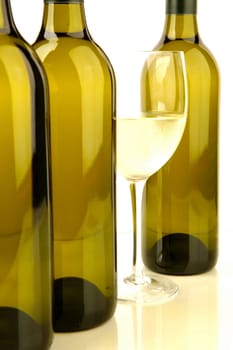 White wine bottles isolated against a white background