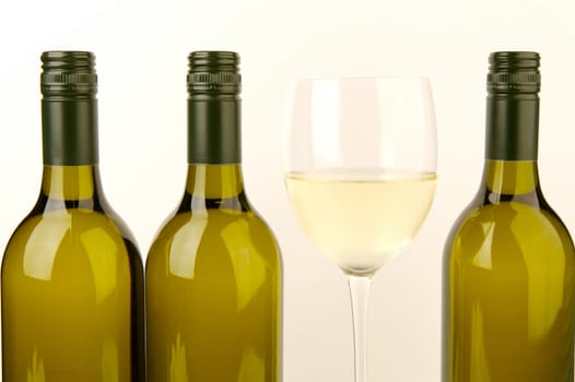 White wine bottles isolated against a white background