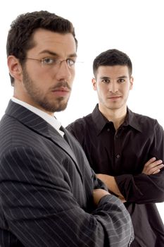 successful young executives posing with crossed arms against white background