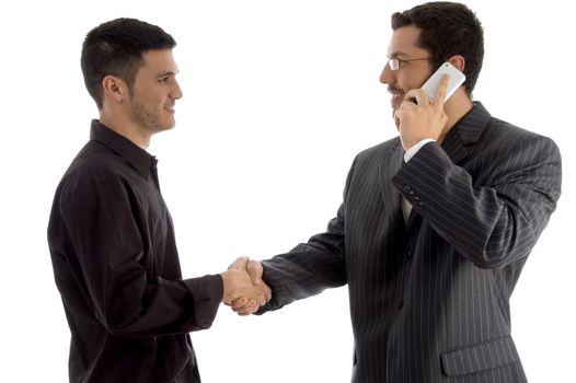 businesspeople communicating and shaking hand against white background
