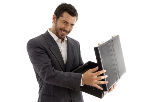 successful attorney smiling and opening his bag against white background