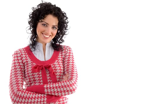 smiling woman with crossed arms looking at camera against white background