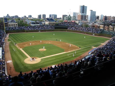 The Cubs home ballpark with retro scoreboard and ivy on the outfield wall