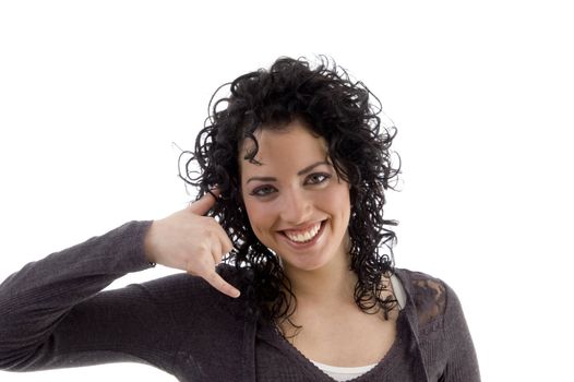 smiling female showing telephonic gesture on an isolated background