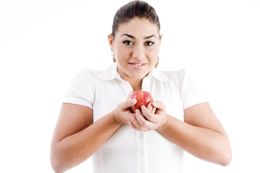 pretty young caucasian holding an apple on an isolated background