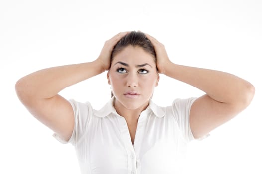 pretty young caucasian tensed against white background