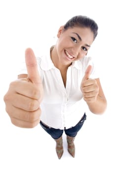 pretty young caucasian showing thumbs up hand gesture on an isolated background