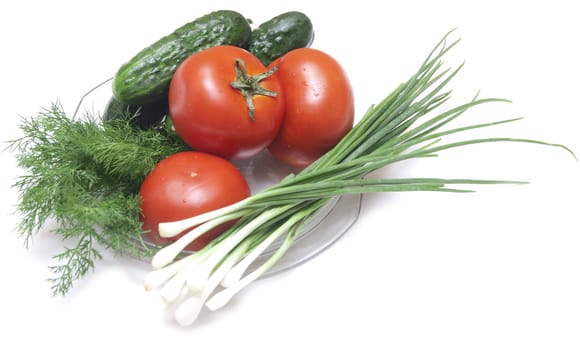 tomatoes and cucumbers on the cutting board