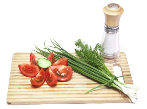 tomatoes and cucumbers on the cutting board