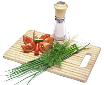 tomatoes and cucumbers on the cutting board