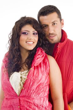 young couple standing in front of camera on an isolated background