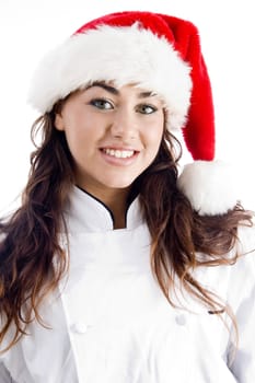 smiling chef wearing christmas hat against white background