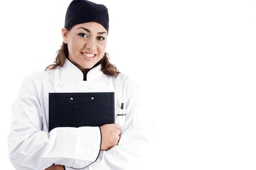 beautiful female chef holding notepad against white background