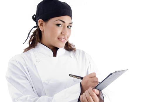 close up view of professional female chef with menu against white background