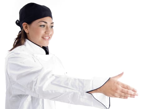 beautiful female chef offering handshake of someone with white background