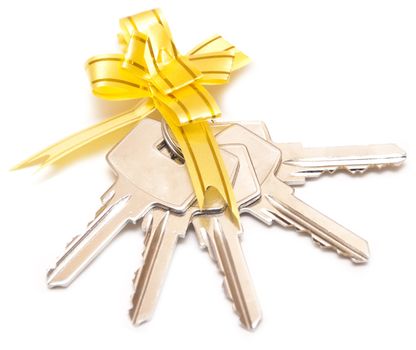 bunch of keys with yellow bow is isolated on the white