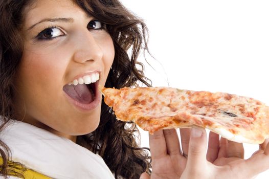 pretty woman eating delicious pizza against white background