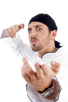 angered male chef posing with karate on an isolated white background