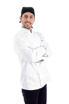 professional chef looking at camera standing with crossed arms against white background