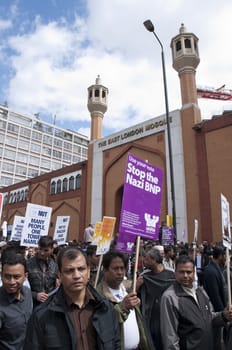 LONDON - JUNE 20: Thousands march in rally against the British National Party and the English Defence League in East London. June 20, 2010 in London, England.