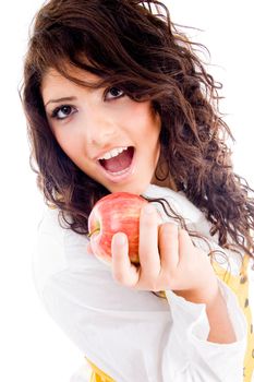 gorgeous woman eating fresh apple on an isolated background
