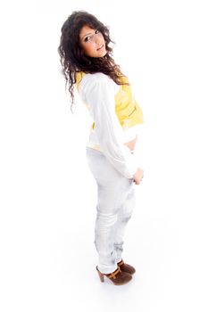 young pretty female standing in front of camera with white background