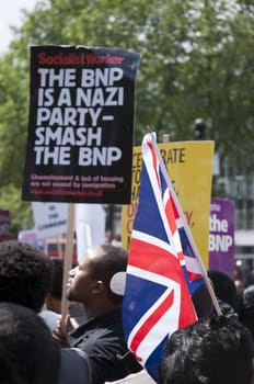 LONDON - JUNE 20: Thousands march in rally against the British National Party and the English Defence League in East London. June 20, 2010 in London, England.