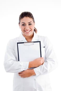 smiling doctor holding writing pad against white background