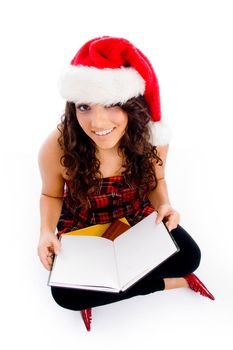 female with christmas hat and blank book on an isolated white background