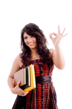 college student showing ok sign on an isolated white background