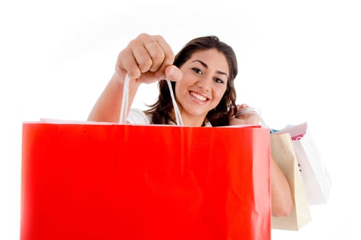 portrait of woman showing shopping bags with white background