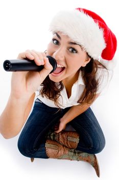 model holding karaoke and wearing christmas hat against white background