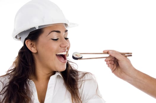 young architect eating sushi food on an isolated white background