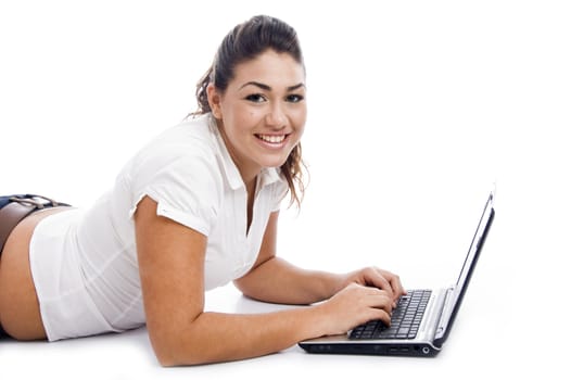 side pose of laying female with laptop on an isolated background