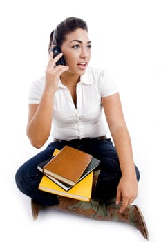 young student talking on mobile against white background