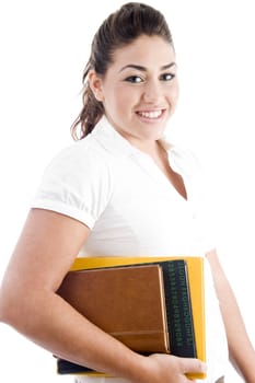 side pose of happy student with books on an isolated white background
