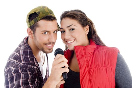 young male and female singer with microphone on an isolated background